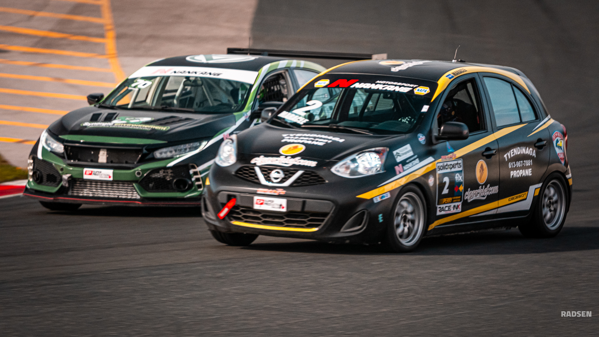 Side by side racing action on the straight